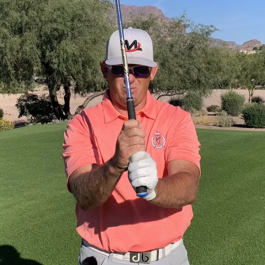 hold a golf club