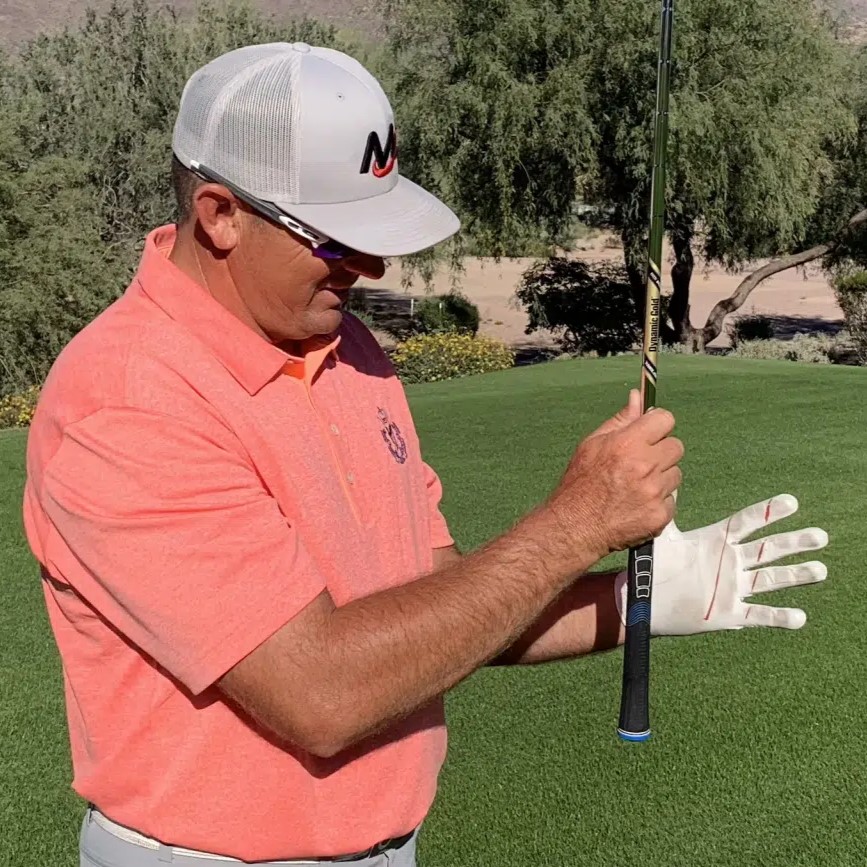 hold a golf club
